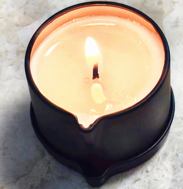 Aromatherapy Massage Candle for sex made of coconut wax, burning softly with a warm glow.