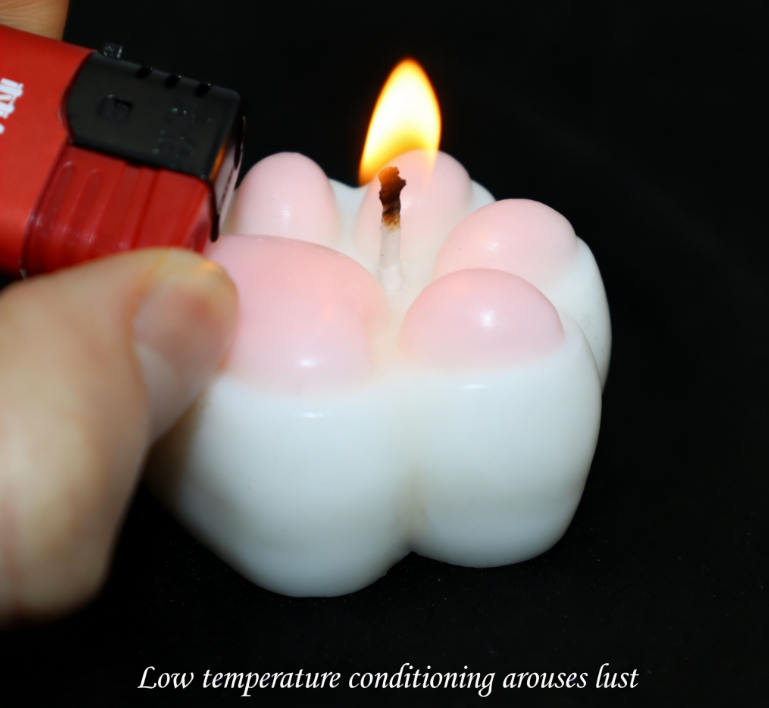 Low Temperature BDSM Cat Claw Candle being lit, showcasing safe wax play for couples at 43°C.