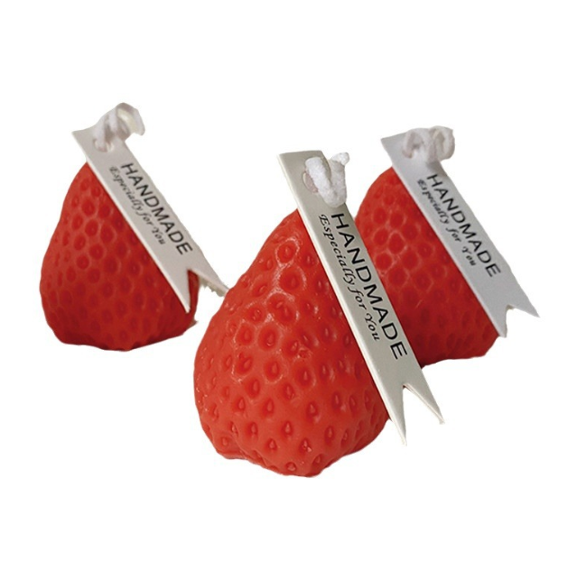 Strawberry Low Temp Candle: three handmade strawberry-shaped candles with tags.