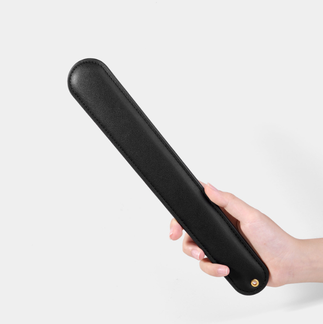 BDSM Spanking Toys Leather Paddles in hand, showcasing exquisite craftsmanship and design for intense sensations.